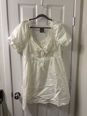 Mini Ivory Dress with Puff Sleeves, Corset Style Bodice, and Ruffle Trim